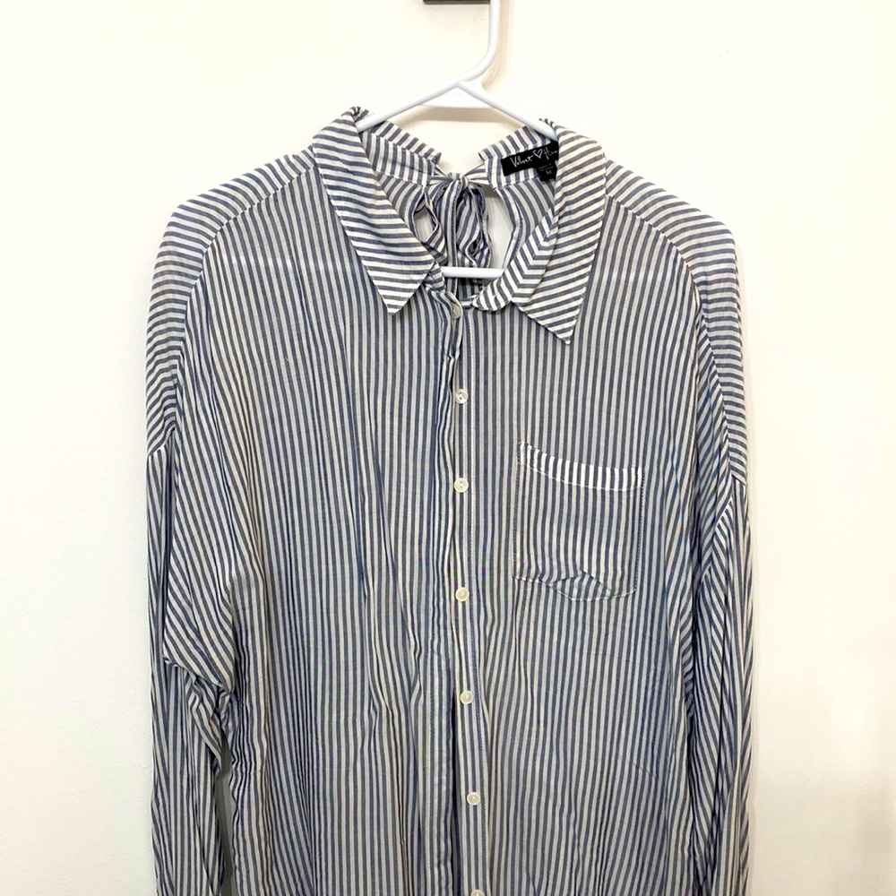 Long sleeve woman’s button up blouse. Light soft material.